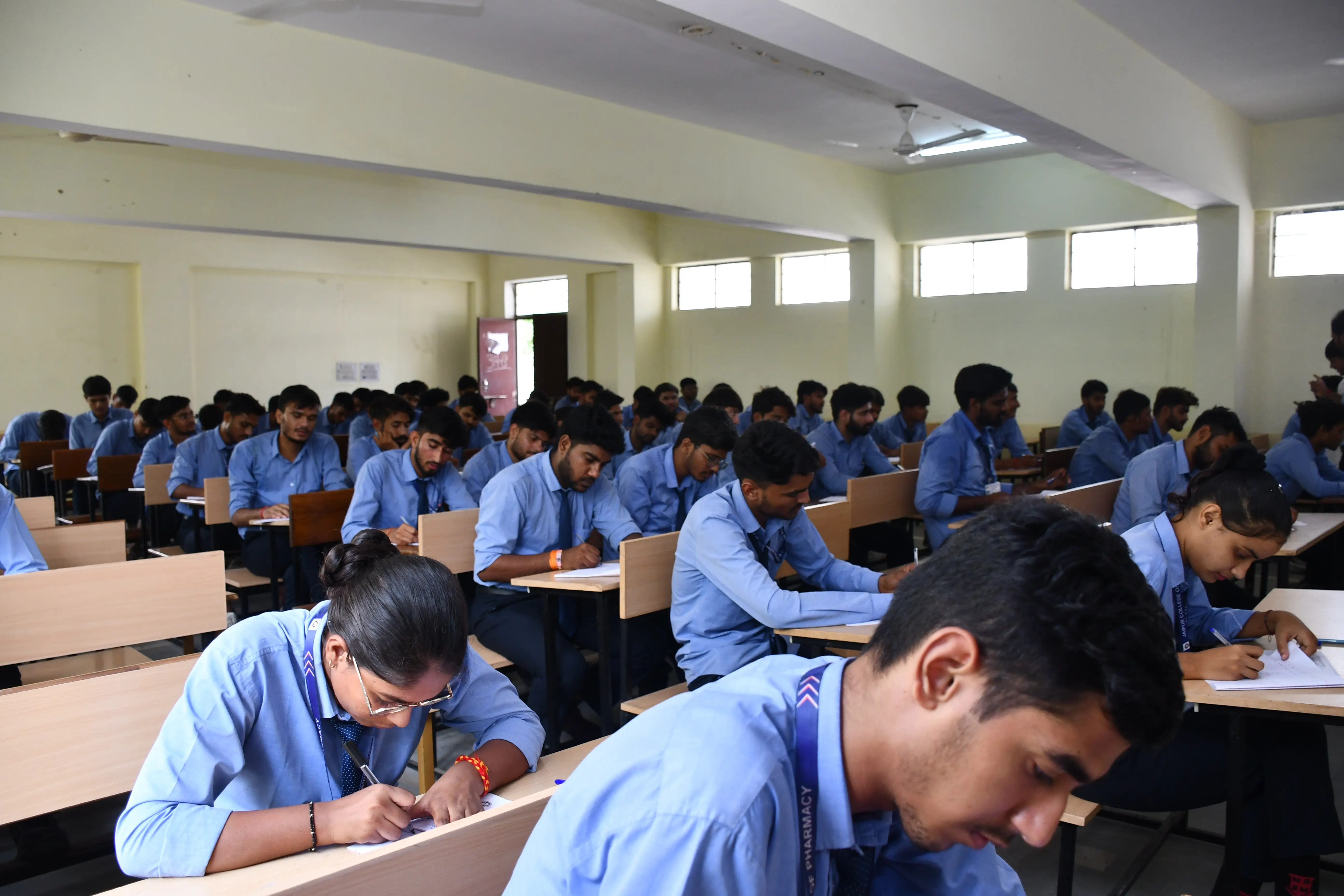 Students learning in a Jaipur College of Pharmacy classroom